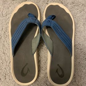Olukai Ulele Slate Blue/Charcoal Flip Flop Sandal Men's US sizes 13. 
Pre-own